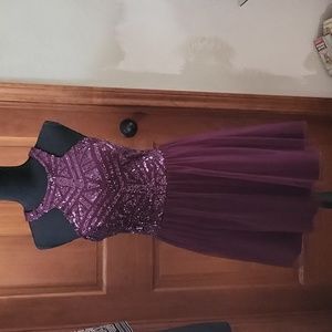 Purple sequin prom dress with double closures in back